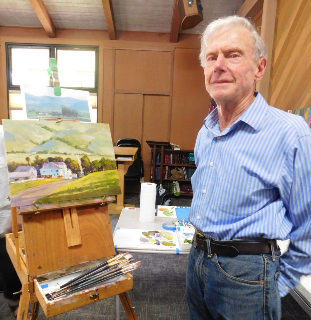 Artist Ed Lucey stands in his studio